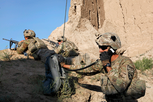 US Army 1st Lts Matthew White left and Kenneth Hurst center hold a map while talking with US Army Capt Rodney Freeman right about the plan of movement for a patrol through Petawa village in Afghanistan39s Parwan province June 13 2014 White Hurst and Freeman are assigned to the 101st Airborne Division39s Company A 1st Battalion 2nd Brigade Combat Team Task Force Strike The soldiers patrolled to disrupt enemy activity during the Afghan elections