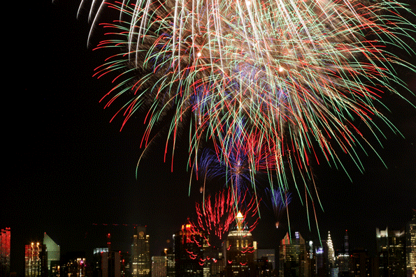 The New York City skyline is seen in the distance as fireworks explode over the Hudson River during the Macy39s fireworks display on July 4 2009 in Weehawken NJ Photo by Yana PaskovaGetty Images