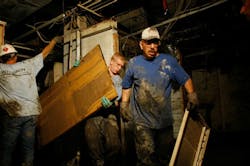 Workers clean out the basement of an office building after the Cedar River inundated it with flood waters June 22 2008 in Cedar Rapids Iowa Workers clean out the basement of an office building after the Cedar River inundated it with flood waters June 22 2008 in Cedar Rapids Iowa