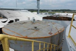 An explosion of what was thought to be nonhazardous materials blew the top off of this tank killing one worker and severely injuring another An explosion of what was thought to be nonhazardous materials blew the top off of this tank killing one worker and severely injuring another