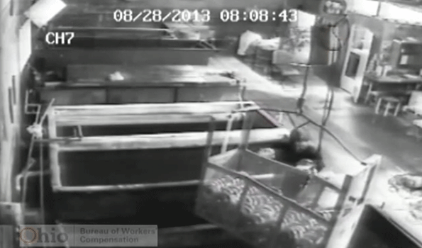 Glenn Jones of Cleveland Ohio shown here on his employerrsquos security video stomped a hole in the wooden floor the night before he said he was injured and on the following day lowered his foot into the floor and lay down on the platform