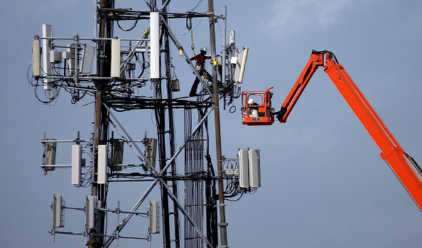 A worker climbs on a cellular communication tower on March 6 2014 in Oakland Calif The US Labor Department is partnering with the Federal Communications Commission and leaders in the telecommunications industry to improve safety for workers Photo by Justin SullivanGetty Images