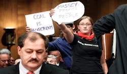 Protester Kate Rooth R holds a sign as Chairman and CEO of Massey Energy Company Don Blankenship L prepares to testify for a hearing before the Labor Health and Human Services Education and Related Agencies Subcommittee of the Senate Appropriations Committee May 20 2010 on Capitol Hill in Washington DC The hearing was to examine issues regarding the safety of coal mining Protester Kate Rooth R holds a sign as Chairman and CEO of Massey Energy Company Don Blankenship L prepares to testify for a hearing before the Labor Health and Human Services Education and Related Agencies Subcommittee of the Senate Appropriations Committee May 20 2010 on Capitol Hill in Washington DC The hearing was to examine issues regarding the safety of coal mining