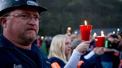 Local coal miner Kevin Honaker participates in a candle light vigil at Marshfork Elementary School held for the deceased coal miners on April 10, 2010 in Montcoal, W.Va. On April 5, 2010, a methane gas explosion killed 29 coal miners at the Massey Energy Co.&apos;s Upper Big Branch Coal Mine. (Photo by Kayana Szymczak/Getty Images)