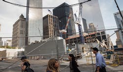 People walk along the northern edge of the Ground Zero construction zone on June 24 2013 in New York City Construction is ongoing on the surrounding complex People walk along the northern edge of the Ground Zero construction zone on June 24 2013 in New York City Construction is ongoing on the surrounding complex