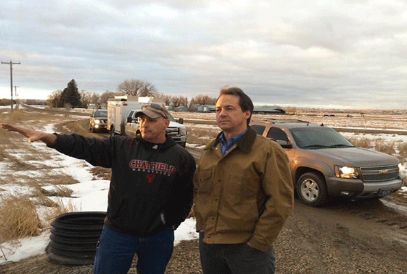 Montana Gov Steve Bullock right visited Glendive Mont on Jan 19 to observe the oil spill on the Yellowstone River and declared a state of emergency for two counties