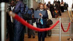 Almaz Mekonnen (C) stands in line with some of the 1,500 people seeking employment during a job fair in Washington, D.C., last year.