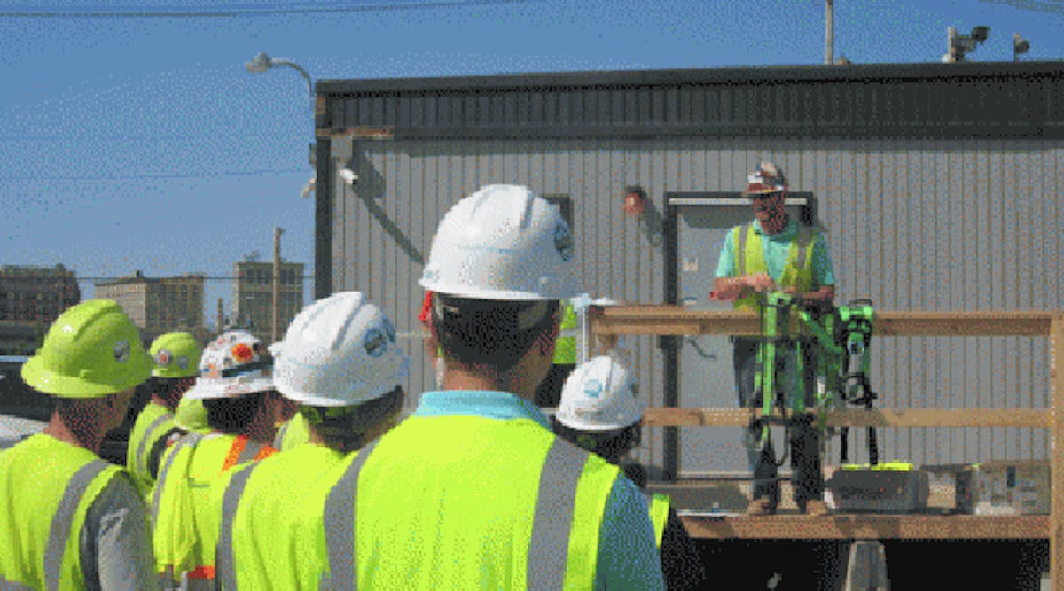 Great Lakes Construction Co. workers and contractors listen to Tyler Edwards discuss fall protection strategies at Fall Safety Stand-Down event last year in Cleveland