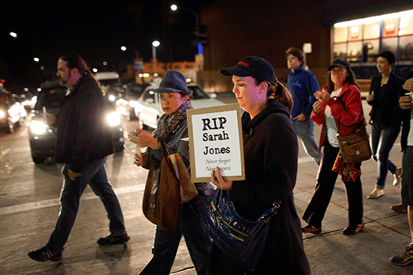 People march March 7 2014 in Los Angeles along Sunset Boulevard from the Directors Guild of America to the International Cinematographers Guild national offices in a candlelight walk and memorial for Sarah Jones an assistant camerawoman who was killed by a train while shooting the Gregg Allman biopic film Midnight Rider The remembrance of the 27yearold camerawoman was organized by members of the International Cinematographers Guild and the production community who want to highlight the importance of safety
