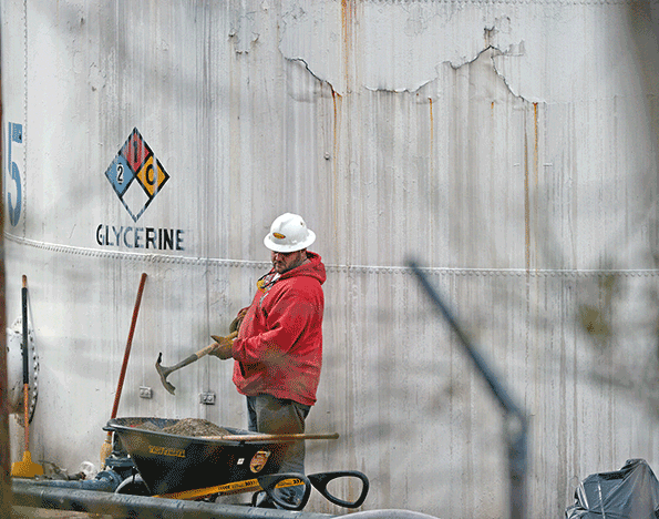 An unidentified worker at Freedom Industries shovels NAPA premium oil absorbent on Jan 10 2014 in Charleston WVa West Virginia American Water determined MCHM chemical had overwhelmed the plant39s capacity to keep it out of the water from a spill at Freedom Industries in Charleston An unknown amount of the hazardous chemical contaminated the public water system for potentially 300000 people in West Virginia