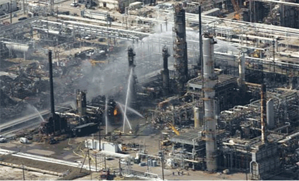 Emergency crews struggle to put out the fire from a blast that killed 15 workers and injured nearly 200 more at BP39s Texas City Tex oil refinery on March 23 2005