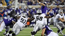 Taylor Heinicke (#6 of the Minnesota Vikings) throws the ball under pressure form Mario Jr. Edwards (#97), Neiron Ball (#58) and Ben Heeney (#51) of the Oakland Raiders during the third quarter of the preseason game on Aug. 22 at TCF Bank Stadium in Minneapolis. The Vikings defeated the Raiders 20-12.