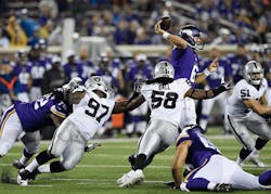 Taylor Heinicke 6 of the Minnesota Vikings throws the ball under pressure form Mario Jr Edwards 97 Neiron Ball 58 and Ben Heeney 51 of the Oakland Raiders during the third quarter of the preseason game on Aug 22 at TCF Bank Stadium in Minneapolis The Vikings defeated the Raiders 2012 Taylor Heinicke 6 of the Minnesota Vikings throws the ball under pressure form Mario Jr Edwards 97 Neiron Ball 58 and Ben Heeney 51 of the Oakland Raiders during the third quarter of the preseason game on Aug 22 at TCF Bank Stadium in Minneapolis The Vikings defeated the Raiders 2012