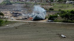 Debris litters a farmer&apos;s field after An explosion leveled the West Fertilizer Co., shown from the air on April 18, 2013 in West, Texas.