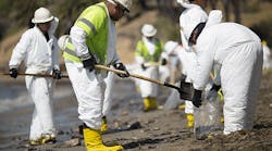 A crew cleans oil from the beach at Refugio State Beach on May 20, 2015 north of Goleta, Calif. About 21,000 gallons spilled from an abandoned pipeline on the land near Refugio State Beach, spreading over four miles of beach within hours. The largest oil spill ever in U.S. waters at the time it occurred in the same section of the coast where numerous offshore oil platforms can be seen, giving birth to the modern American environmental movement.