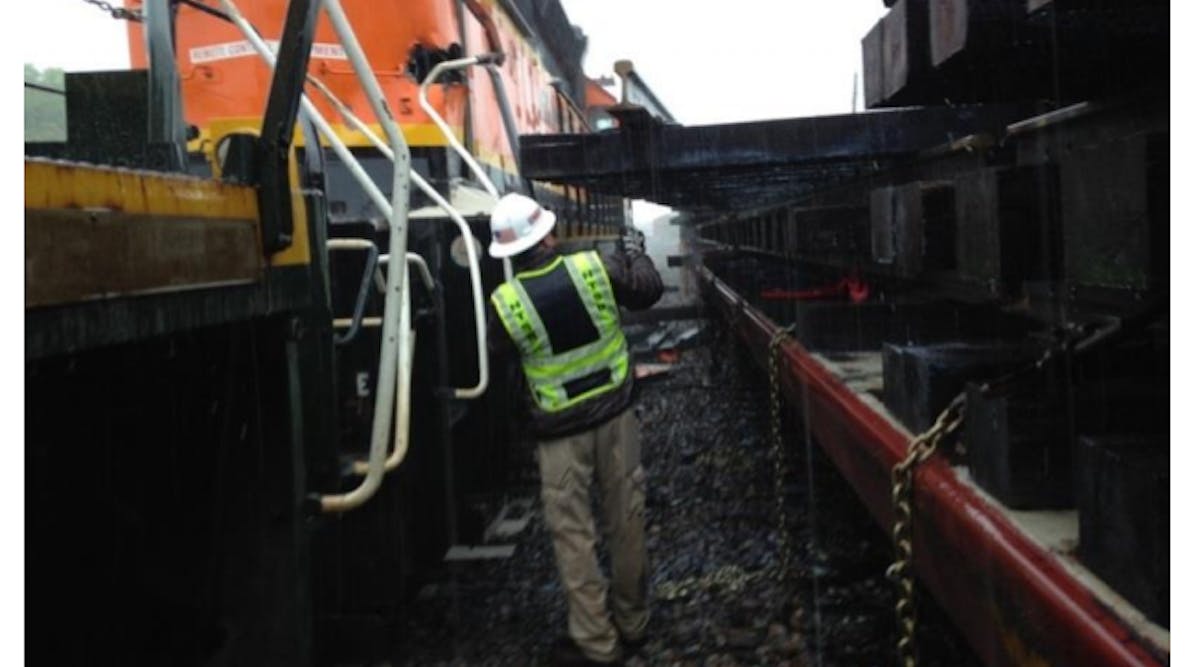 Figure 2 in the NTSB investigation report shoes a dislodged track panel and damage to the BNSF train. The Federal Railroad Administration is credited with the photo.