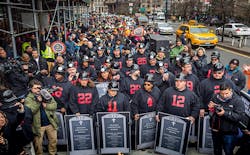 Photographer Michael Nigro captured this photo of hundreds of construction workers and union members who demonstrated in lower Manhattan on Jan 18 2017 in a planned act of civil disobedience They are carrying coffins and grave markers representing the construction workers who have died in New York in recent months Thirtyone people were quotarrestedquot to symbolize the 31 construction site deaths that have occurred in New York City in the past 24 months Photographer Michael Nigro captured this photo of hundreds of construction workers and union members who demonstrated in lower Manhattan on Jan 18 2017 in a planned act of civil disobedience They are carrying coffins and grave markers representing the construction workers who have died in New York in recent months Thirtyone people were quotarrestedquot to symbolize the 31 construction site deaths that have occurred in New York City in the past 24 months