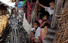 Burmese children live in squalor in small huts without proper sanitation in the slum area of Hlaing Thaya Yangon, Myanmar (Burma). The Burmese government spends only 0.3 percent of its gross domestic product on health, the lowest amount worldwide.