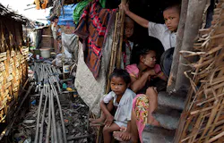 Burmese children live in squalor in small huts without proper sanitation in the slum area of Hlaing Thaya Yangon Myanmar Burma The Burmese government spends only 03 percent of its gross domestic product on health the lowest amount worldwide Burmese children live in squalor in small huts without proper sanitation in the slum area of Hlaing Thaya Yangon Myanmar Burma The Burmese government spends only 03 percent of its gross domestic product on health the lowest amount worldwide