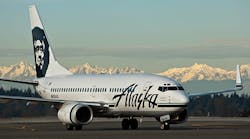 An Alaska Airlines 737 at Sea-Tac with the Olympic Mountains in the background.