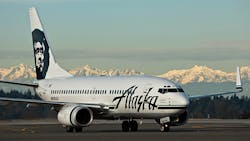An Alaska Airlines 737 at SeaTac with the Olympic Mountains in the background An Alaska Airlines 737 at SeaTac with the Olympic Mountains in the background