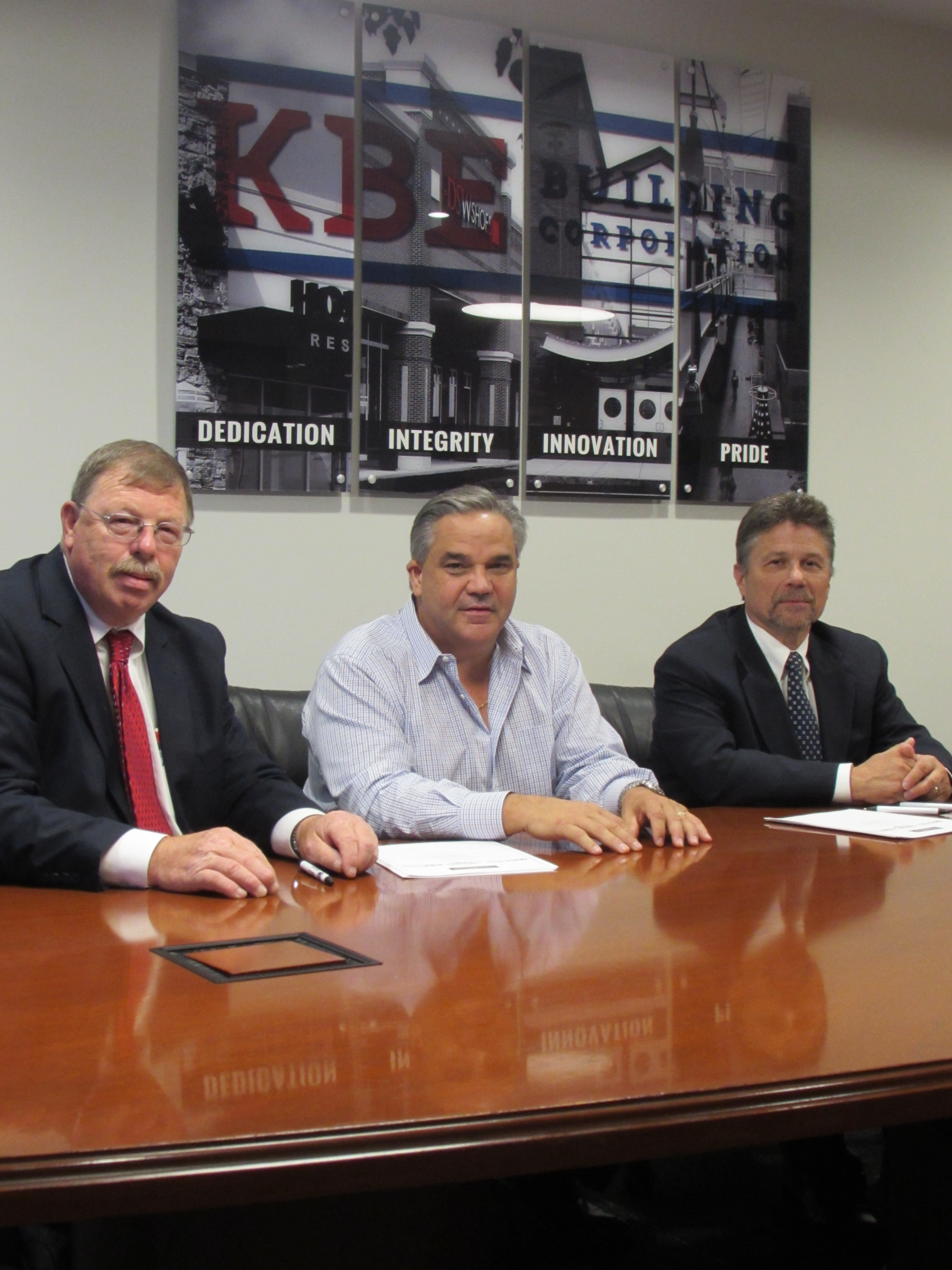 Kenneth Tucker Director of the State of Connecticut Department of Labor Division of Occupational Safety and Health Mike Kolakowski KBE Building Corporation Principal Owner and CEO Roman Krochmalnyckyj Acting Area Director of Federal OSHA Hartford Area Office sign OSHA partnership