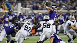 Taylor Heinicke 6 of the Minnesota Vikings throws the ball under pressure form Mario Jr Edwards 97 Neiron Ball 58 and Ben Heeney 51 of the Oakland Raiders during the third quarter of the preseason game on Aug 22 at TCF Bank Stadium in Minneapolis The Vikings defeated the Raiders 2012 Taylor Heinicke 6 of the Minnesota Vikings throws the ball under pressure form Mario Jr Edwards 97 Neiron Ball 58 and Ben Heeney 51 of the Oakland Raiders during the third quarter of the preseason game on Aug 22 at TCF Bank Stadium in Minneapolis The Vikings defeated the Raiders 2012