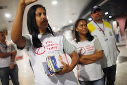 Health workers pass out information on mosquito protection to people arriving in the baggage claim area at Guararapes Gilberto Freyre International Airport on Feb 4 in Recife Pernambuco state Brazil Officials say as many as 100000 people may have already been exposed to the Zika virus in Recife Health workers pass out information on mosquito protection to people arriving in the baggage claim area at Guararapes Gilberto Freyre International Airport on Feb 4 in Recife Pernambuco state Brazil Officials say as many as 100000 people may have already been exposed to the Zika virus in Recife