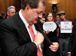 Protesters Kate Rooth and Oscar Ramirez hold signs after Don Blankenship left former chairman and CEO of Massey Energy testified for a hearing before the Labor Health and Human Services Education and Related Agencies Subcommittee of the Senate Appropriations Committee May 20 2010 on Capitol Hill in Washington DC The hearing was to examine issues regarding the safety of coal mining Protesters Kate Rooth and Oscar Ramirez hold signs after Don Blankenship left former chairman and CEO of Massey Energy testified for a hearing before the Labor Health and Human Services Education and Related Agencies Subcommittee of the Senate Appropriations Committee May 20 2010 on Capitol Hill in Washington DC The hearing was to examine issues regarding the safety of coal mining