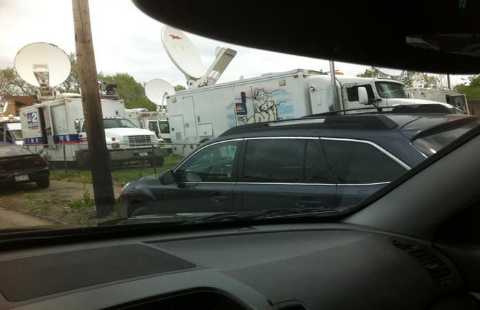 Nearly two dozen satellite trucks were parked in a vacant lot on Seymour Avenue as crews scrambled to broadcast news about three women who were freed and reunited with their families more than a decade after being abducted from Cleveland streets