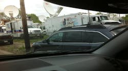 Nearly two dozen satellite trucks were parked in a vacant lot on Seymour Avenue, as crews scrambled to broadcast news about three women who were freed and reunited with their families more than a decade after being abducted from Cleveland streets.