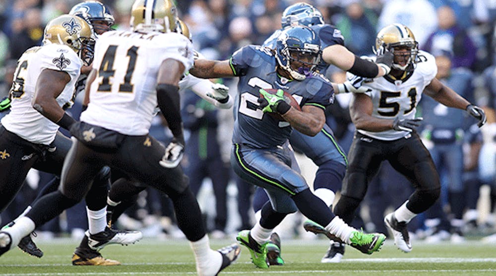 Marshawn Lynch #24 of the Seattle Seahawks runs the ball against the New Orleans Saints during the 2011 NFC wild-card playoff game at Qwest Field on January 8, 2011 in Seattle, Washington.