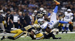 Eric Ebron #85 of the Detroit Lions is tackled by Jairus Byrd #31 of the New Orleans Saints and Kenny Vaccaro #32 during the first half of a game at the Mercedes-Benz Superdome on Dec. 4, 2016 in New Orleans.