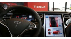 The inside of a Tesla vehicle is viewed as it sits parked in a new Tesla showroom and service center in Red Hook, Brooklyn on July 5, 2016 in New York City.