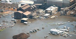 Floodwater left in the wake of Hurricane and Tropical Storm Harvey begins to recede in an industrial area on August 31 near Houston.