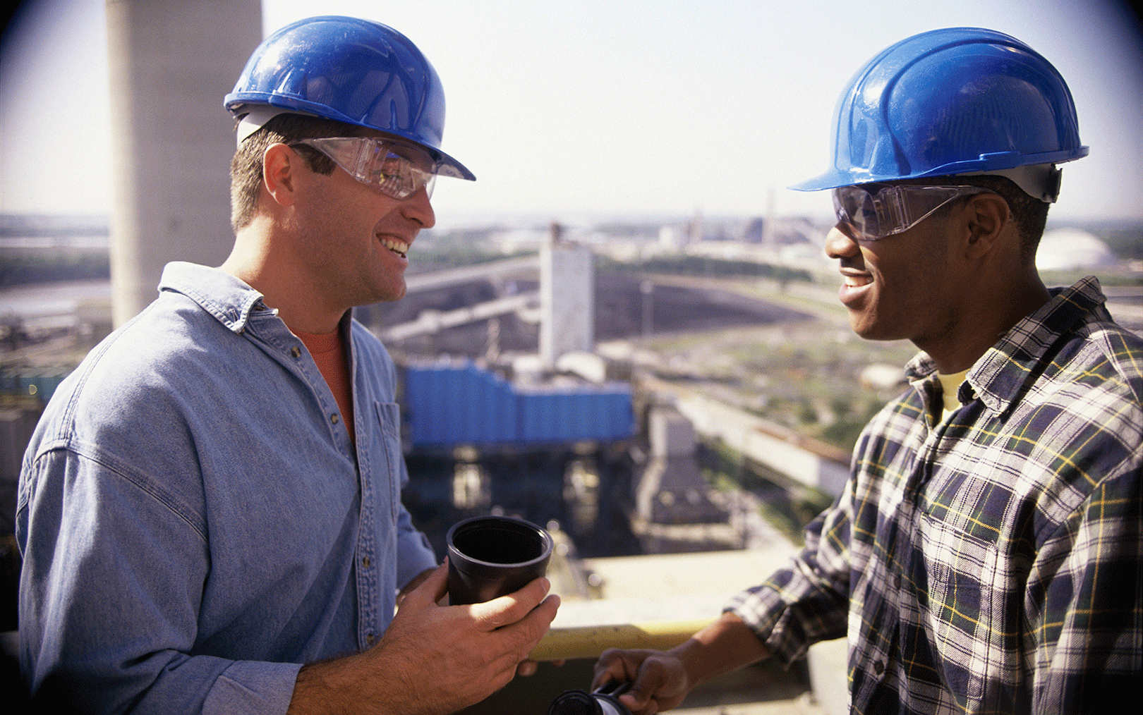 construction workers support each other