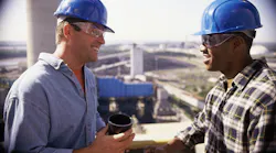 construction workers support each other