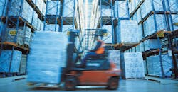 Man Operating Forklift in Warehouse Man Operating Forklift in Warehouse
