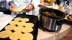 The Avocados From Mexico booth prepared tacos with an avocado topping