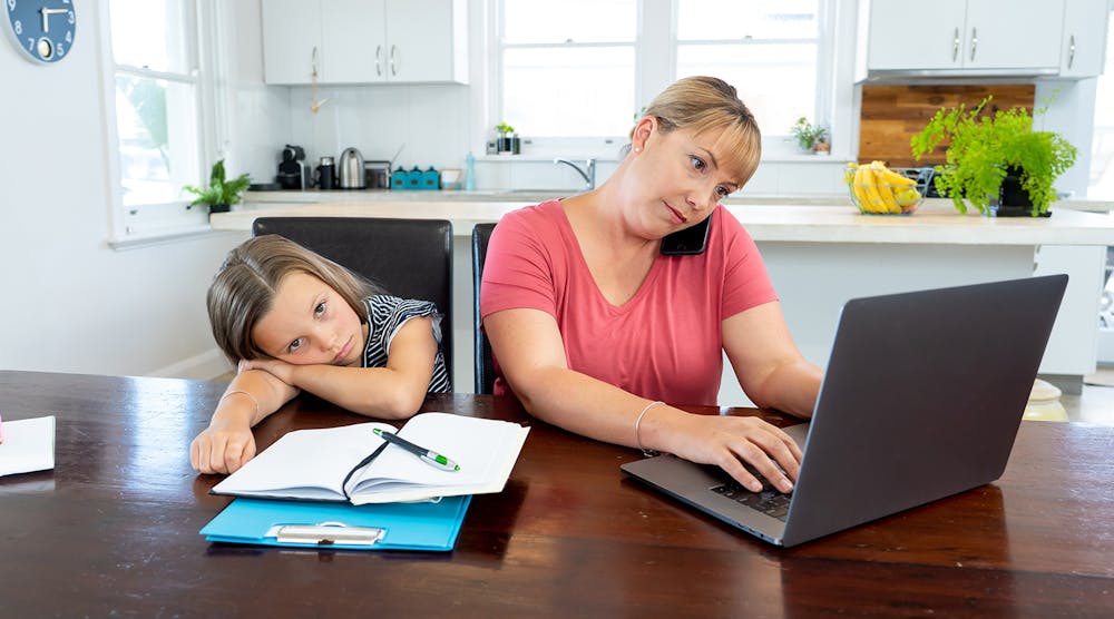 Mother Working From Home With Kid