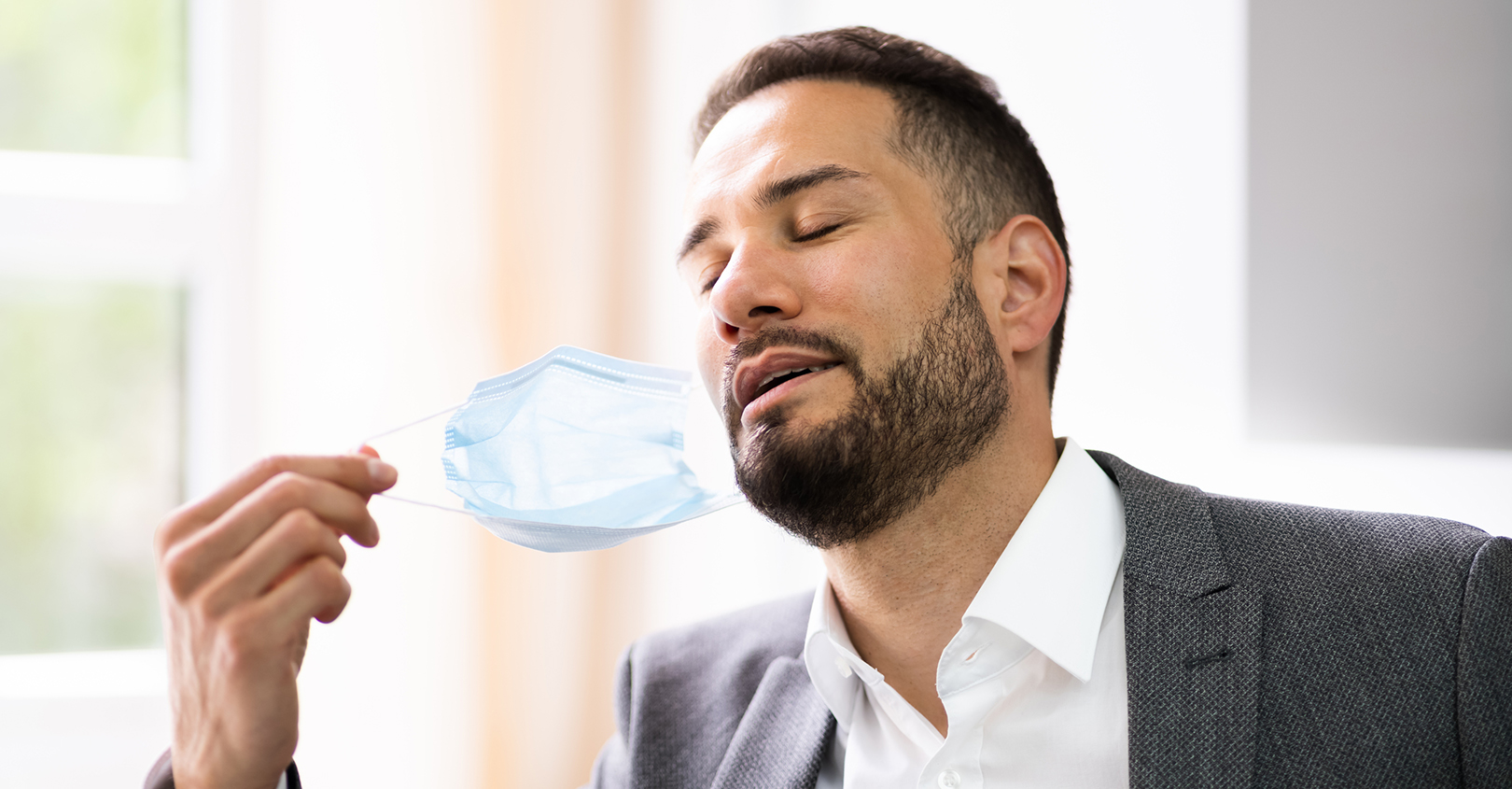 Man Removing Facemask 60d0b8862bda1