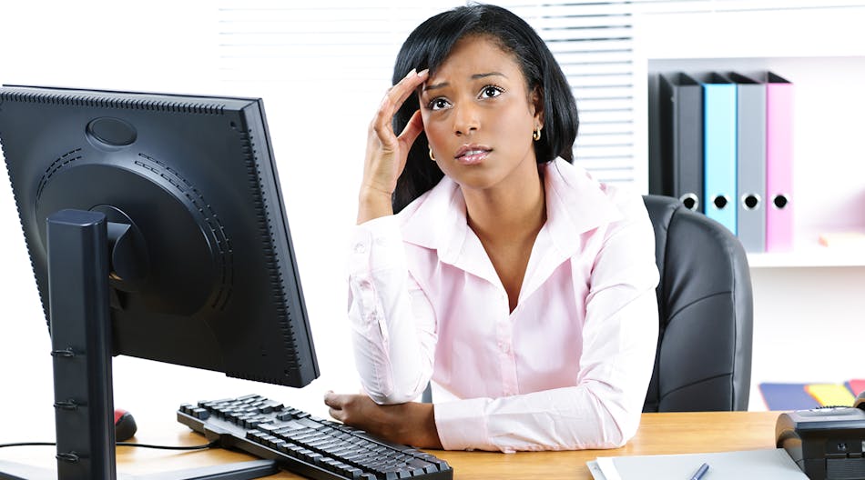Woman Stressed At Desk