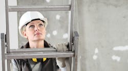 woman climbing on ladder looking upward woman climbing on ladder looking upward