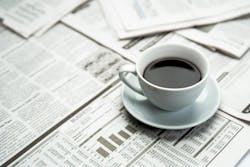 Open newspaper and a cup of coffee Open newspaper and a cup of coffee