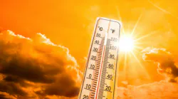 picture of a thermometer in the foreground and clouds and sun in the background