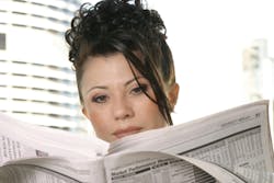 woman reading the newspaper woman reading the newspaper