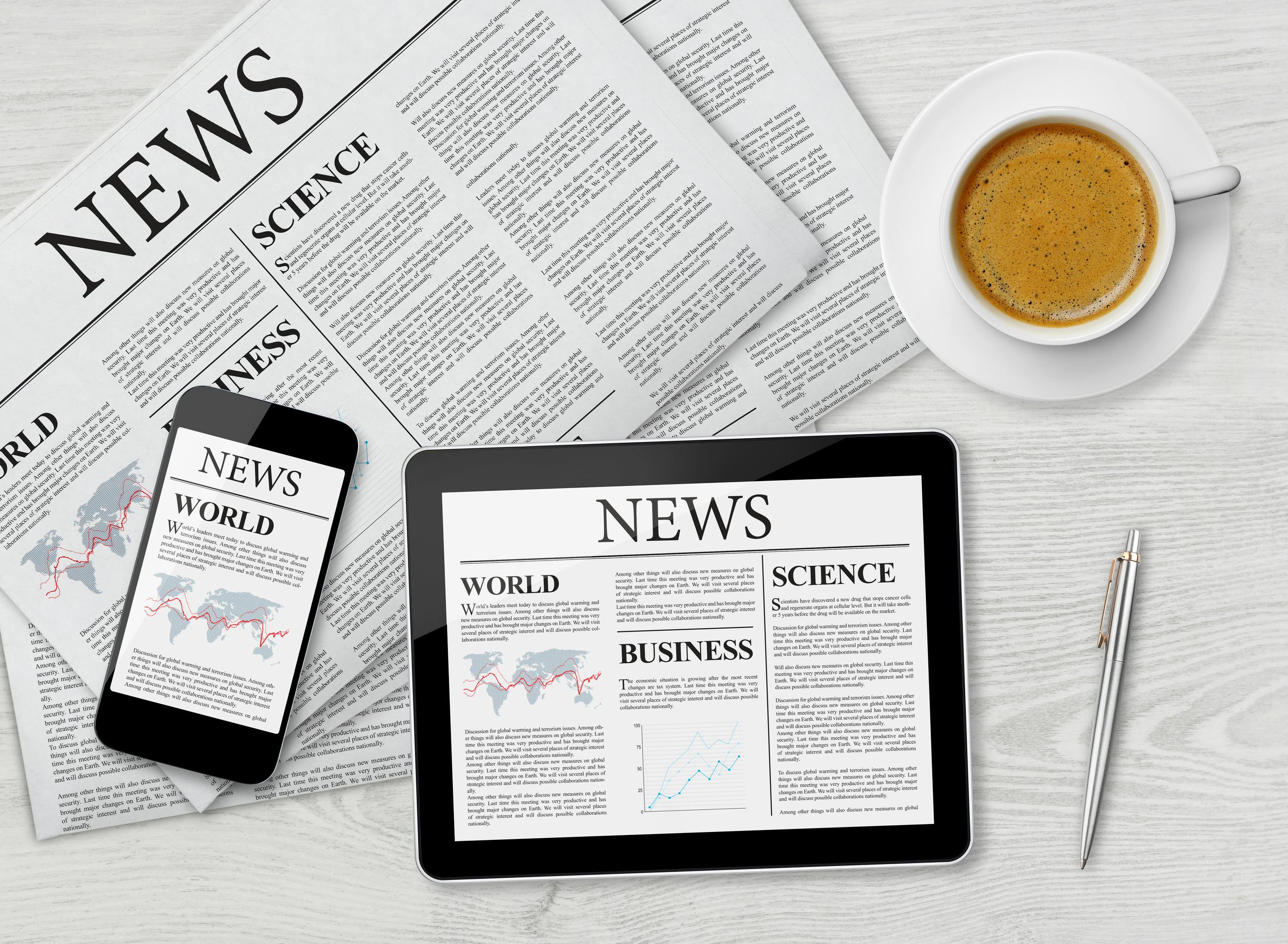 Image of newspaper, tablet displaying news, smartphone displaying news and espresso-based coffee drink