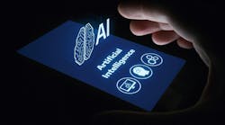 hand grasping smartphone that has a projection of the words artificial intelligence (AI) and symbols of a human head, computer screen and gears hand grasping smartphone that has a projection of the words artificial intelligence (AI) and symbols of a human head, computer screen and gears