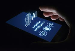 hand grasping smartphone that has a projection of the words artificial intelligence (AI) and symbols of a human head, computer screen and gears hand grasping smartphone that has a projection of the words artificial intelligence (AI) and symbols of a human head, computer screen and gears