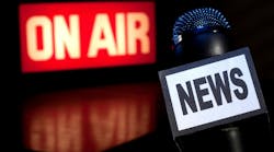 Picture of microphone next to broadcasting 'On Air' sign Picture of microphone next to broadcasting 'On Air' sign